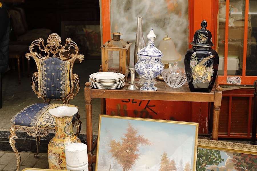 Gilt-framed salon chair beside painted urns